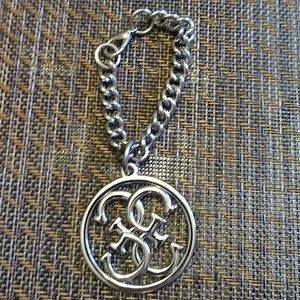 Guess stainless silver bag charm